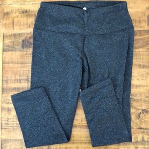 Two pairs of leggings. One Grey, one black. Both M